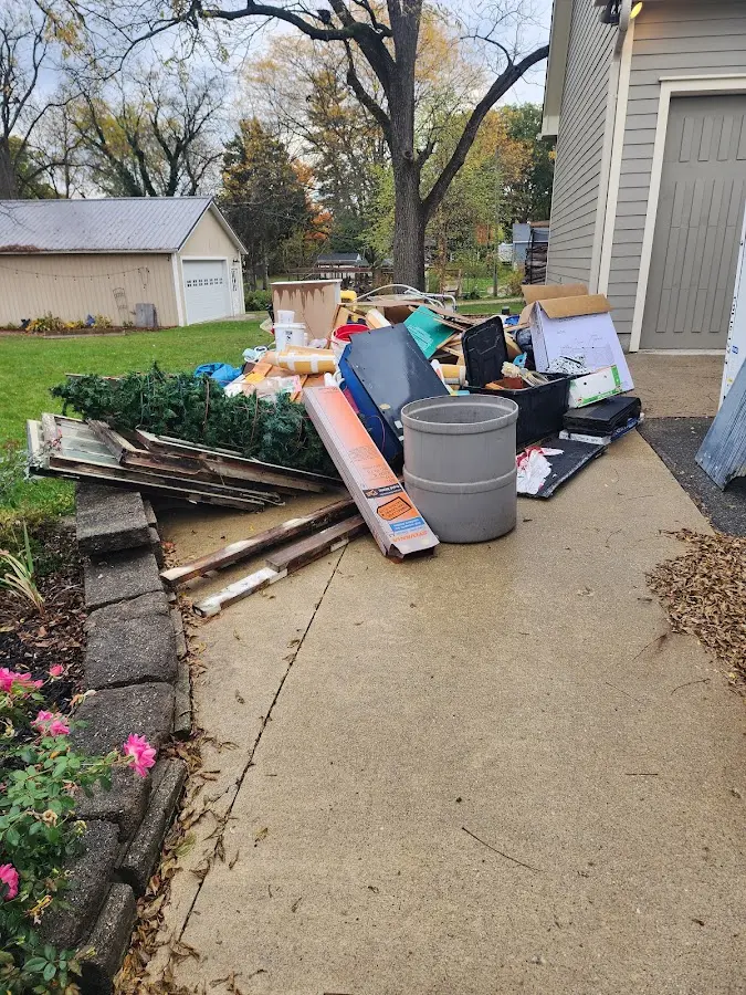 Dumpster being loaded with debris for 30 Yard Dumpster Rental in Lockport